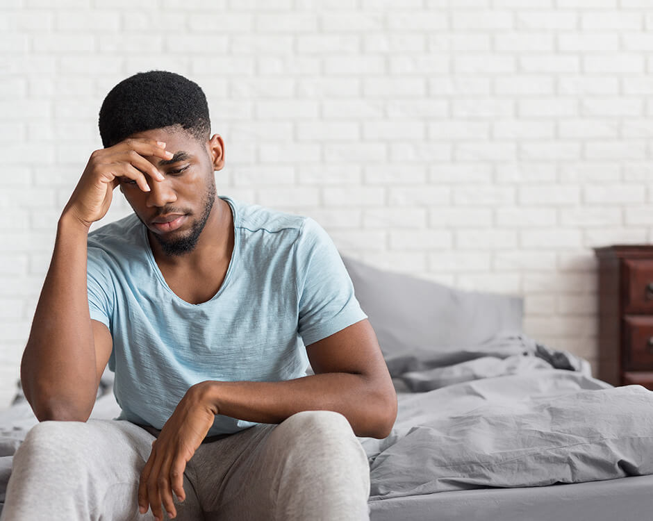 Man experiencing stress and worry related to erectile dysfunction